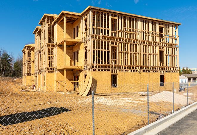 a snapshot of temporary chain link fences protecting a large construction project from unauthorized access in Middleton, MA